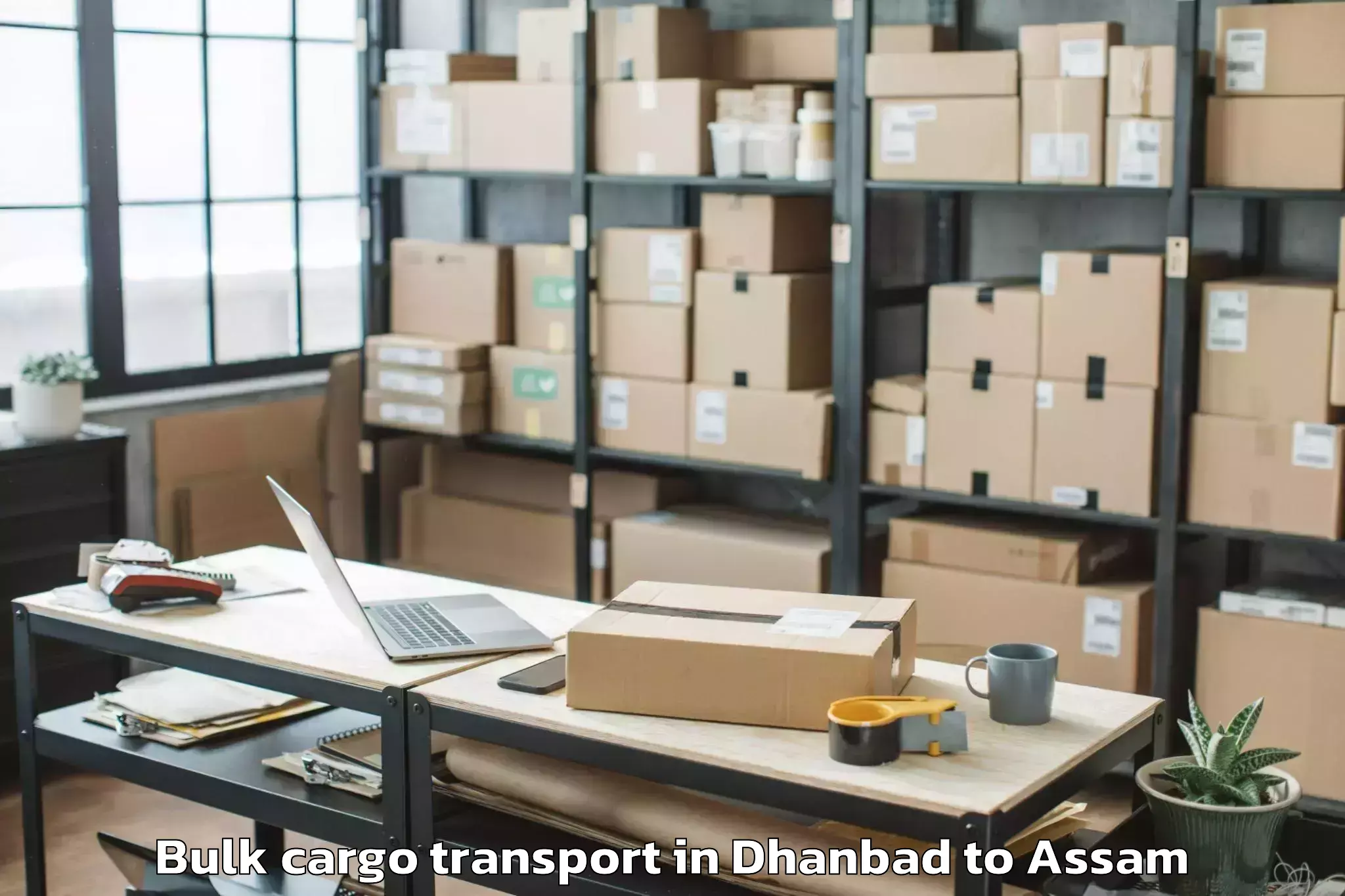 Dhanbad to Kampur Town Bulk Cargo Transport Booking